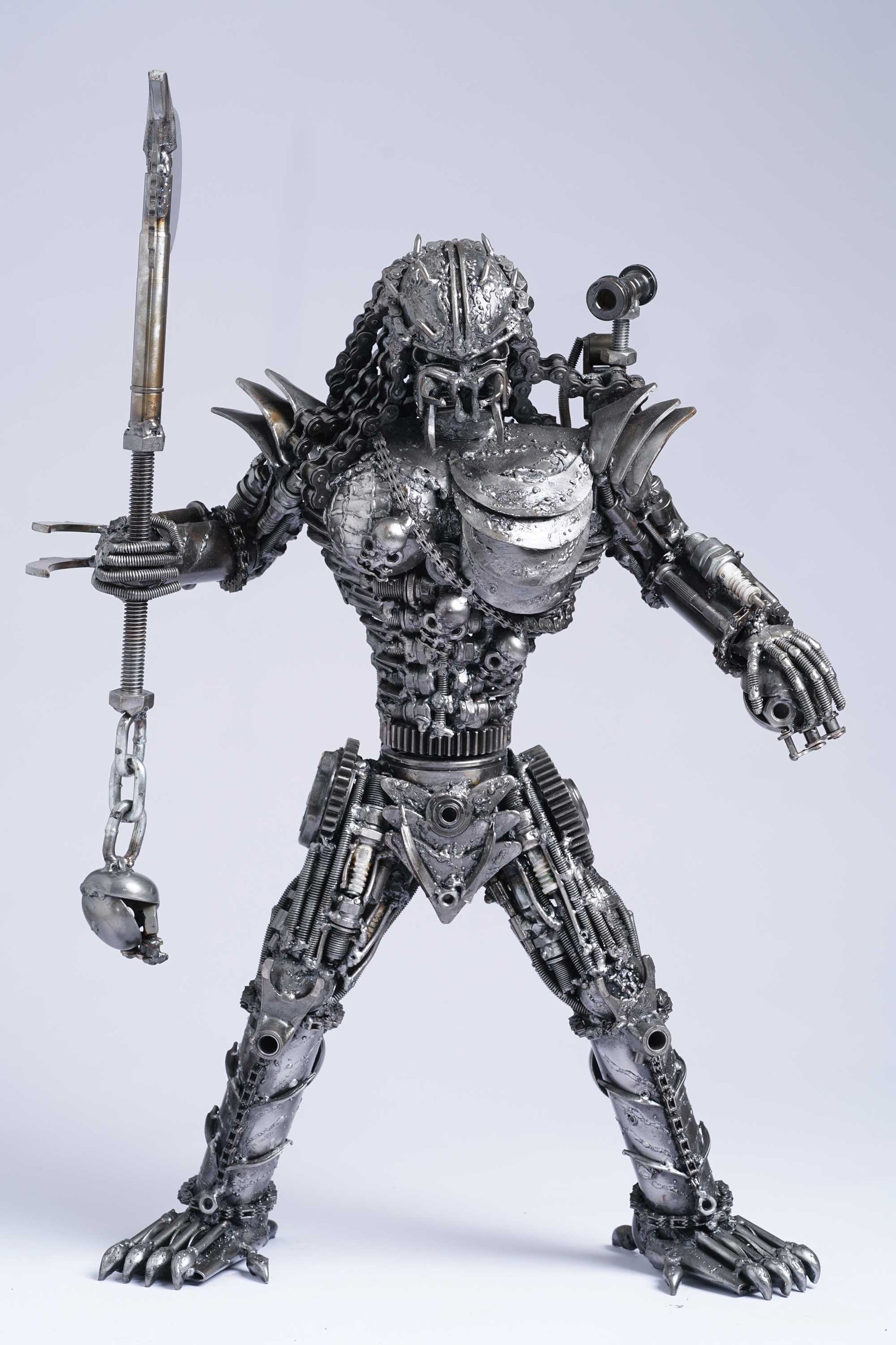Predator metal action figure hand-crafted from junk auto parts