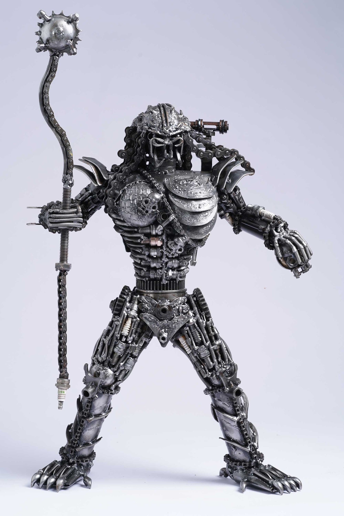 Predator metal action figure hand-crafted from junk auto parts