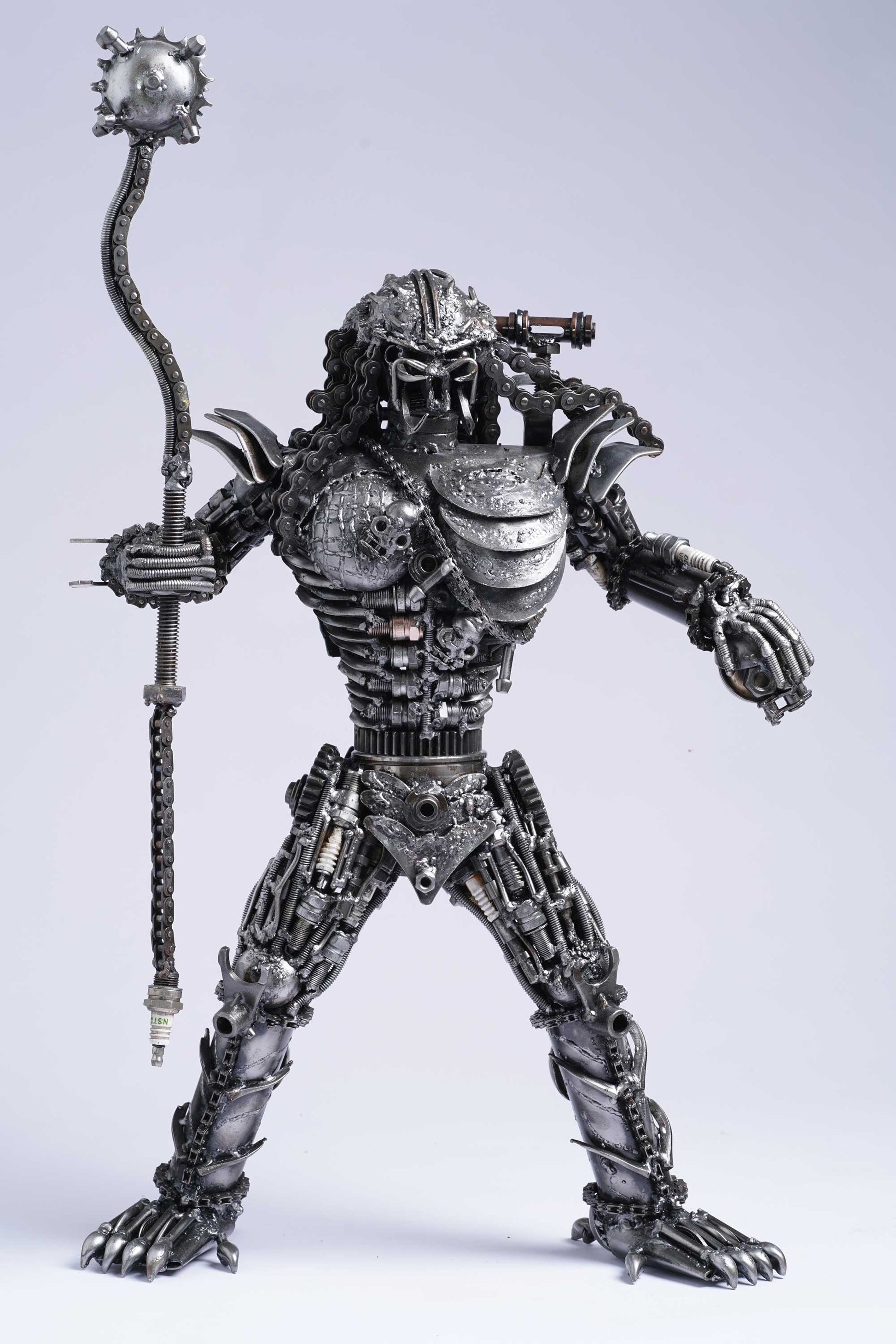 Predator metal action figure hand-crafted from junk auto parts