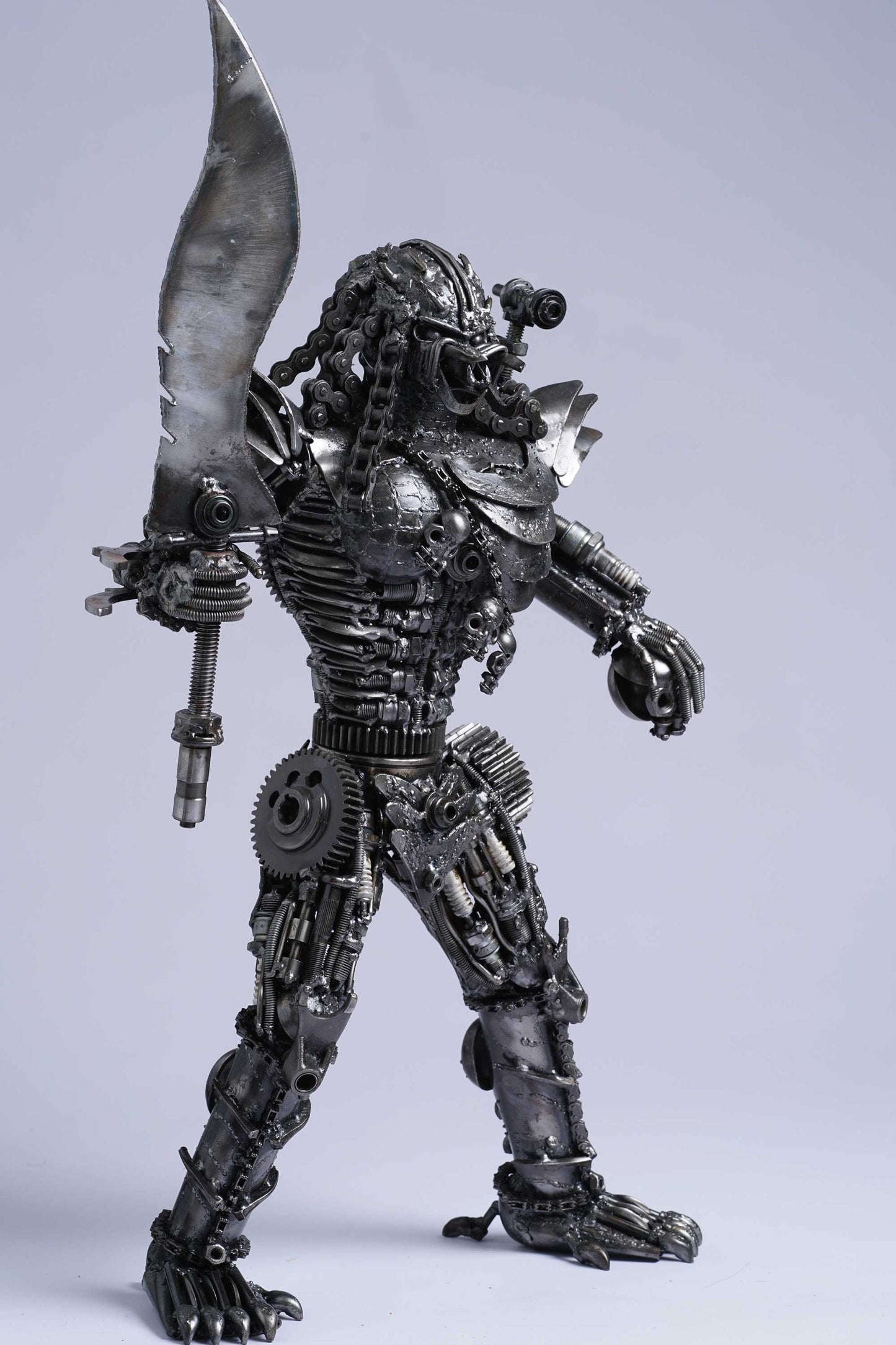 Predator metal action figure hand-crafted from junk auto parts