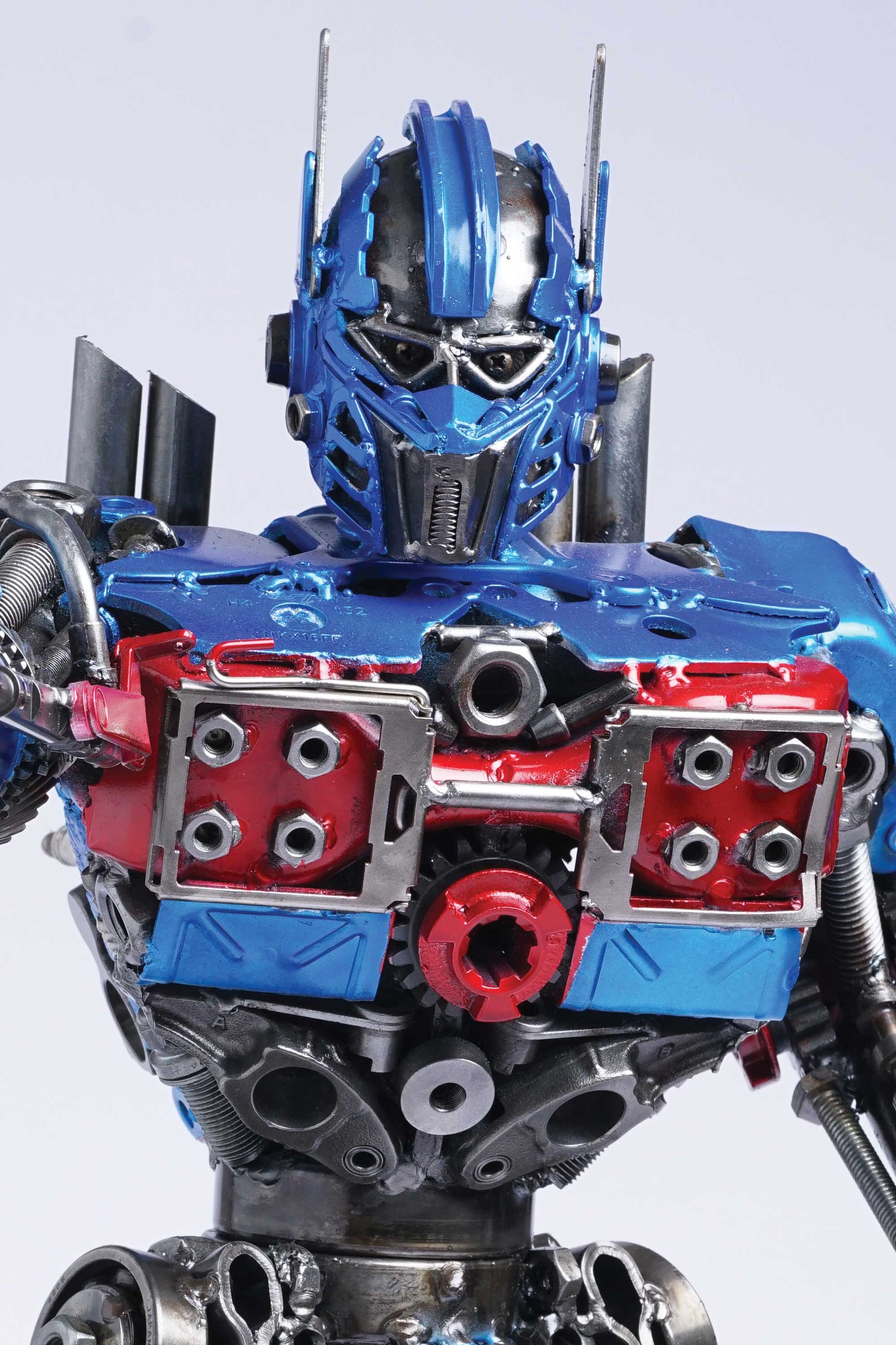 Transformers Optimus Prime metal action figure hand-crafted from junk auto parts with attention to detail