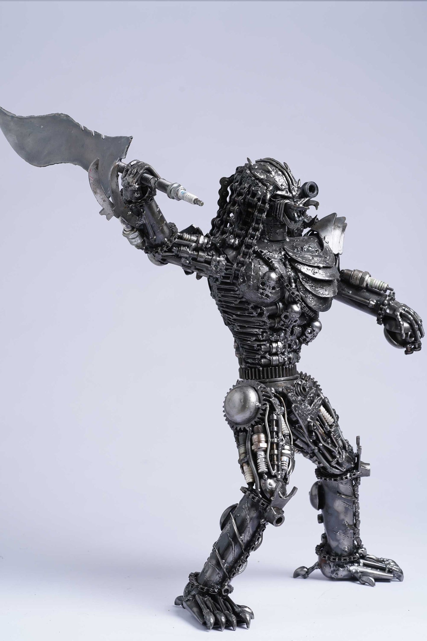 Predator metal action figure hand-crafted from junk auto parts