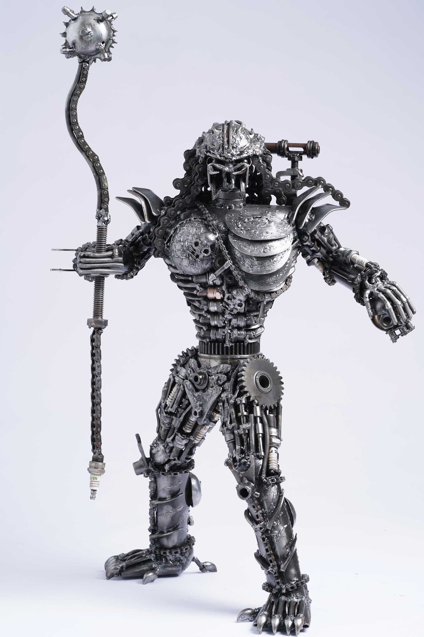 Predator metal action figure hand-crafted from junk auto parts