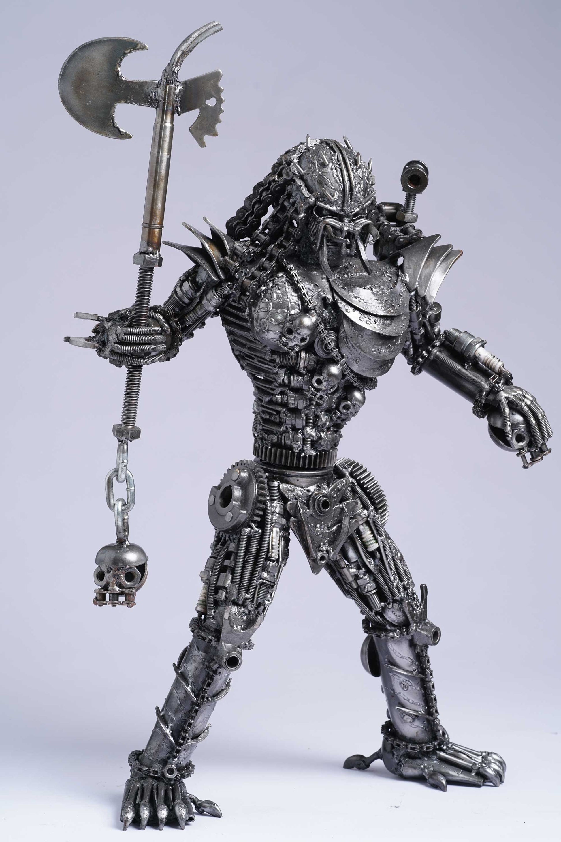 Predator metal action figure hand-crafted from junk auto parts