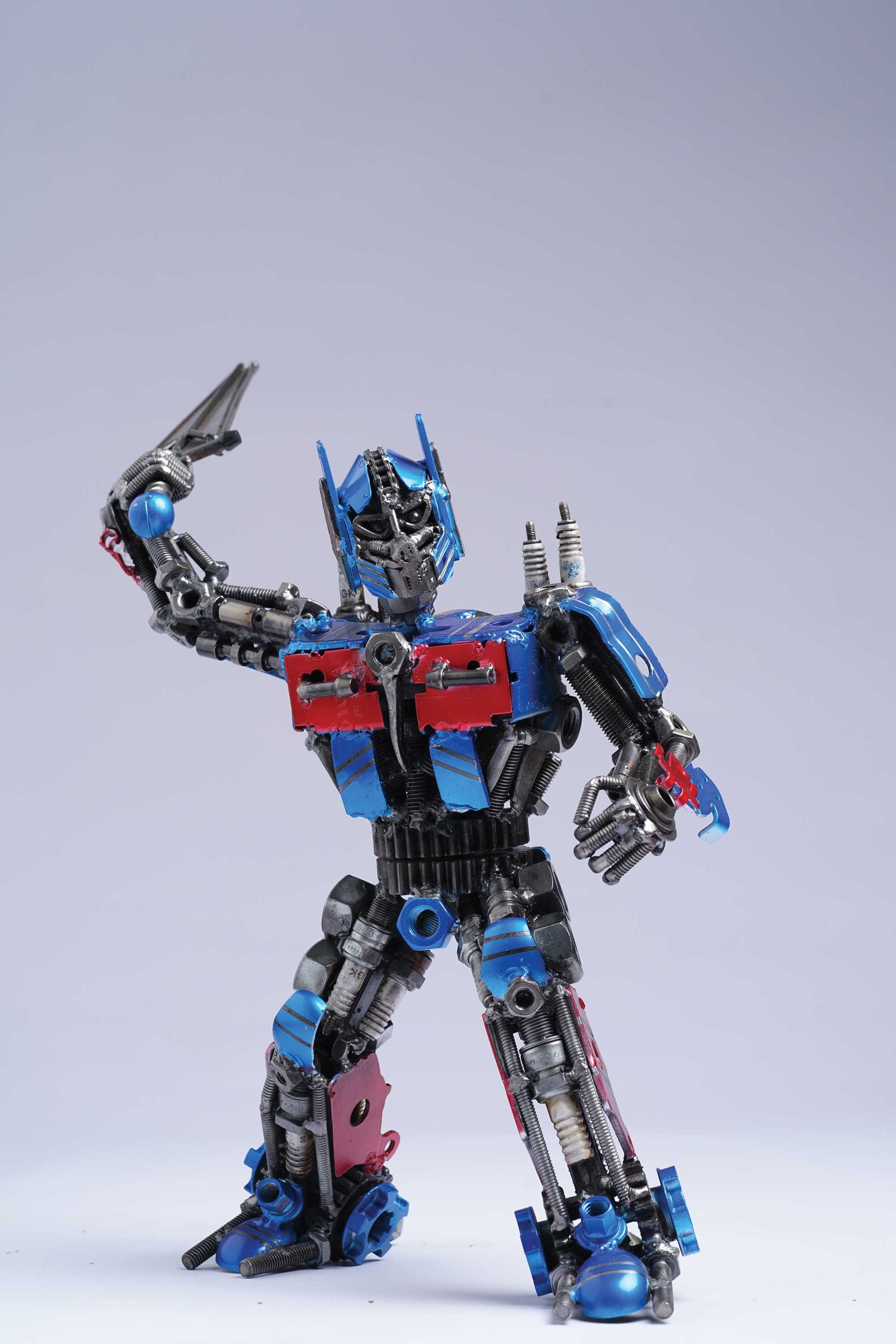 Transformers Optimus Prime metal action figure hand-crafted from junk auto parts with attention to detail