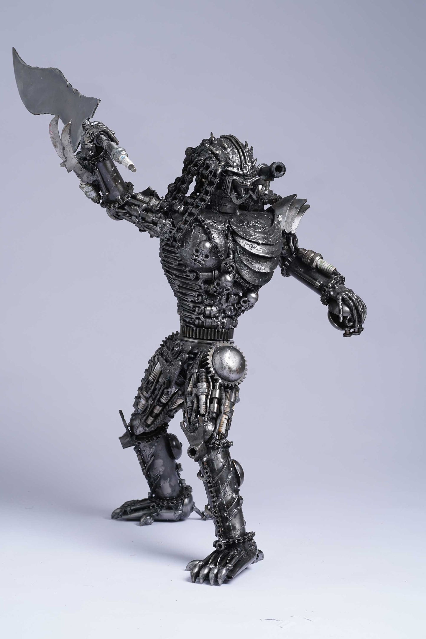 Predator metal action figure hand-crafted from junk auto parts