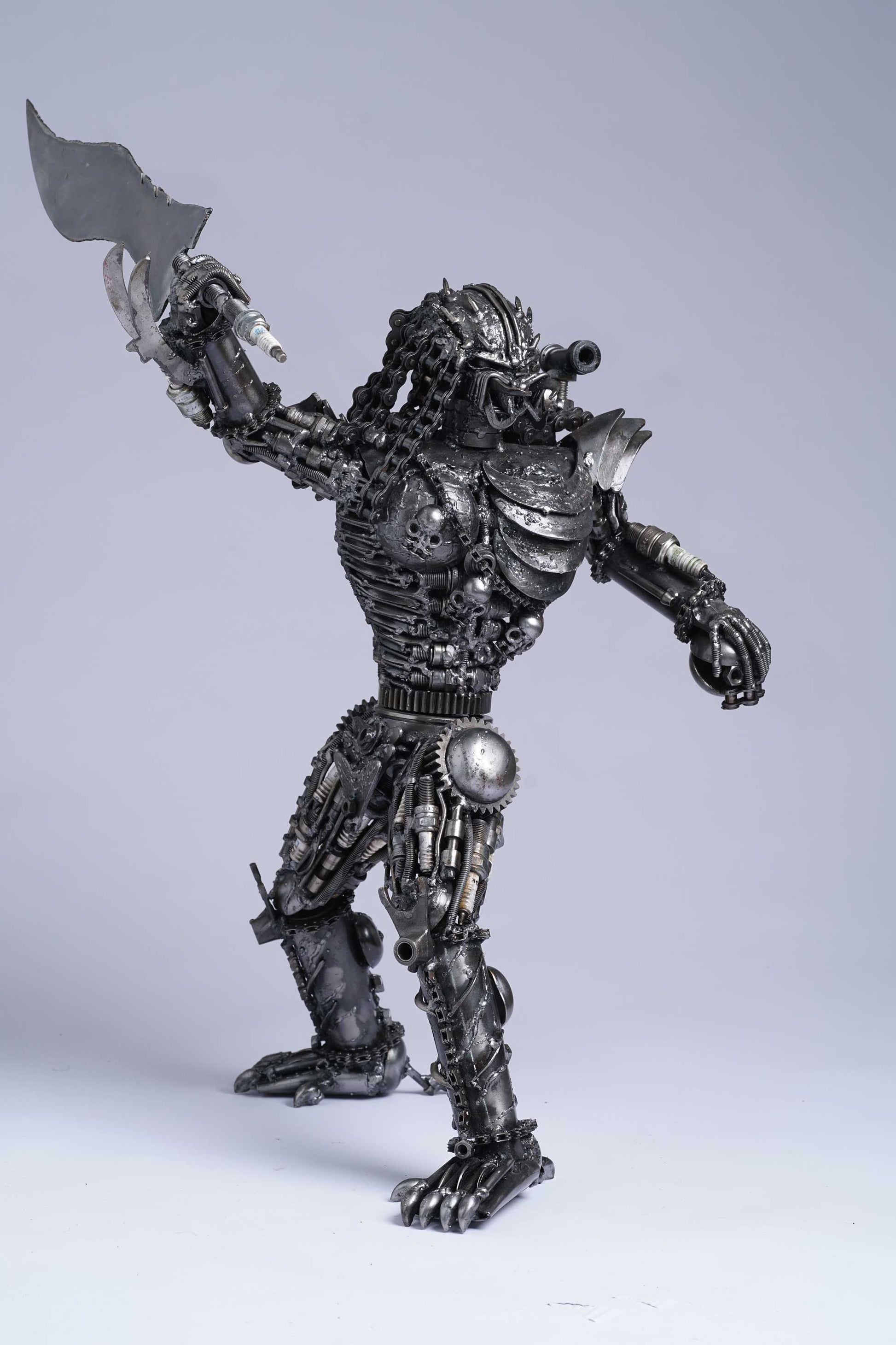 Predator metal action figure hand-crafted from junk auto parts