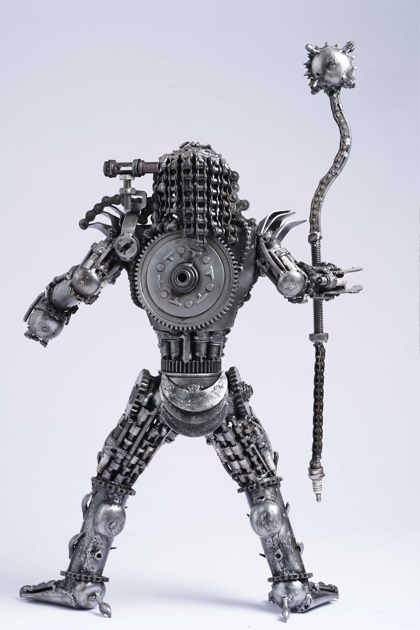 Predator metal action figure hand-crafted from junk auto parts