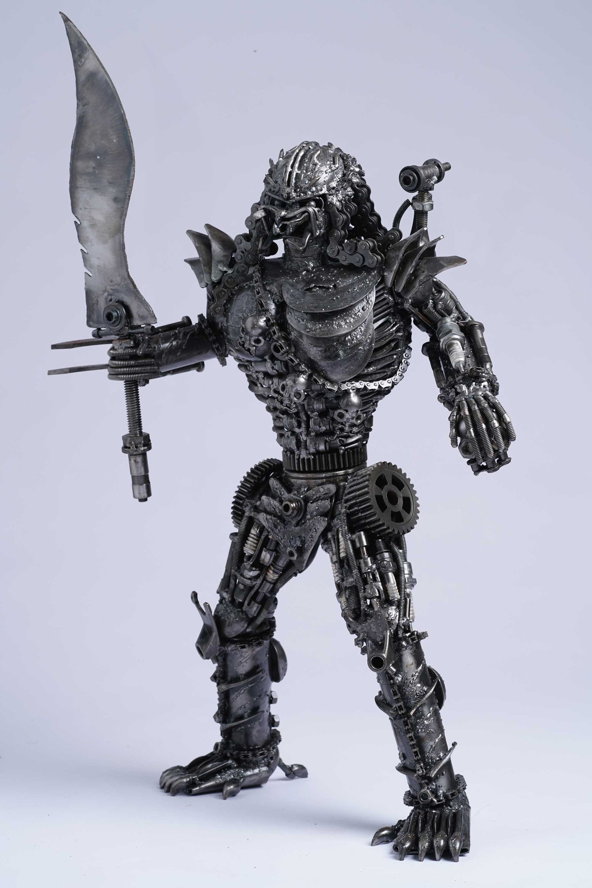 Predator metal action figure hand-crafted from junk auto parts