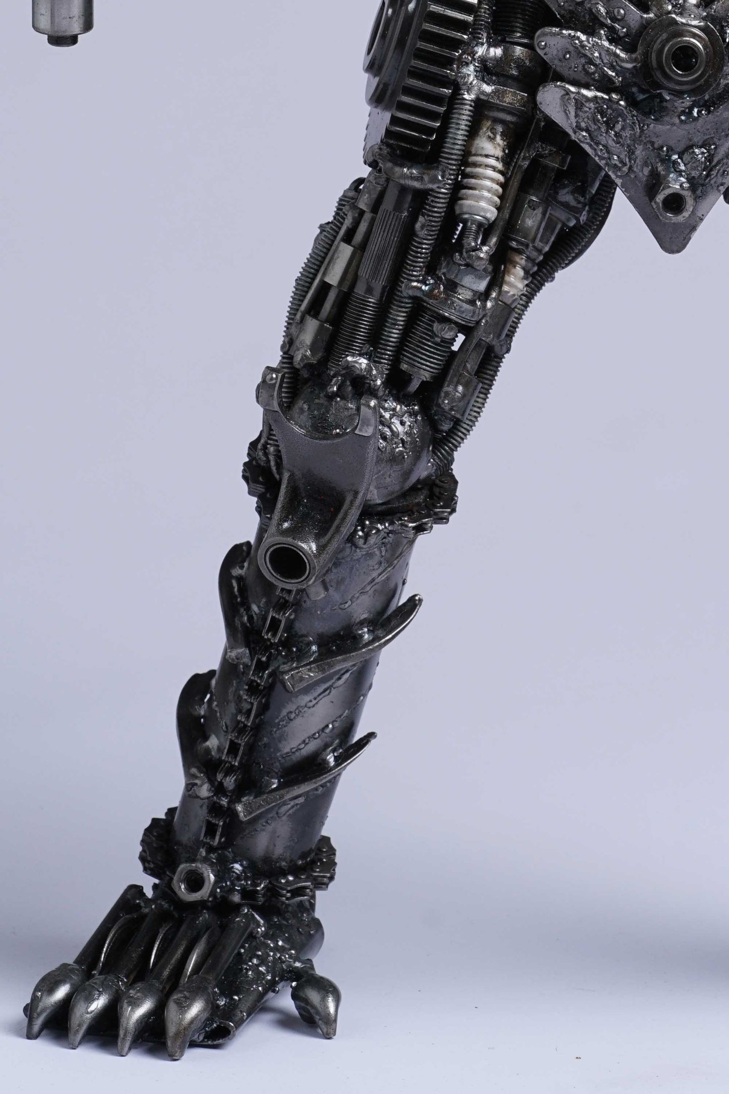 Predator metal action figure hand-crafted from junk auto parts