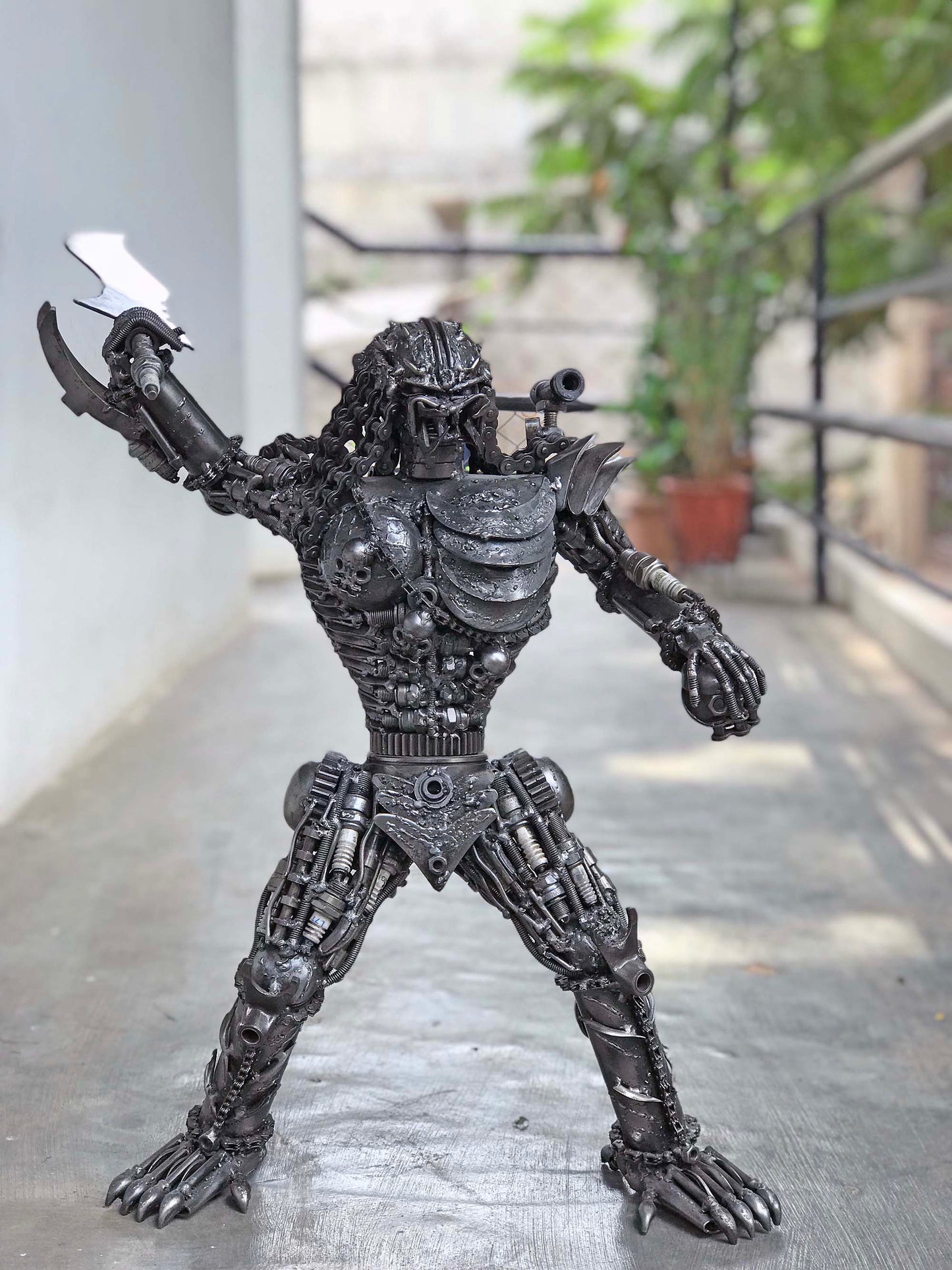 Predator metal action figure hand-crafted from junk auto parts