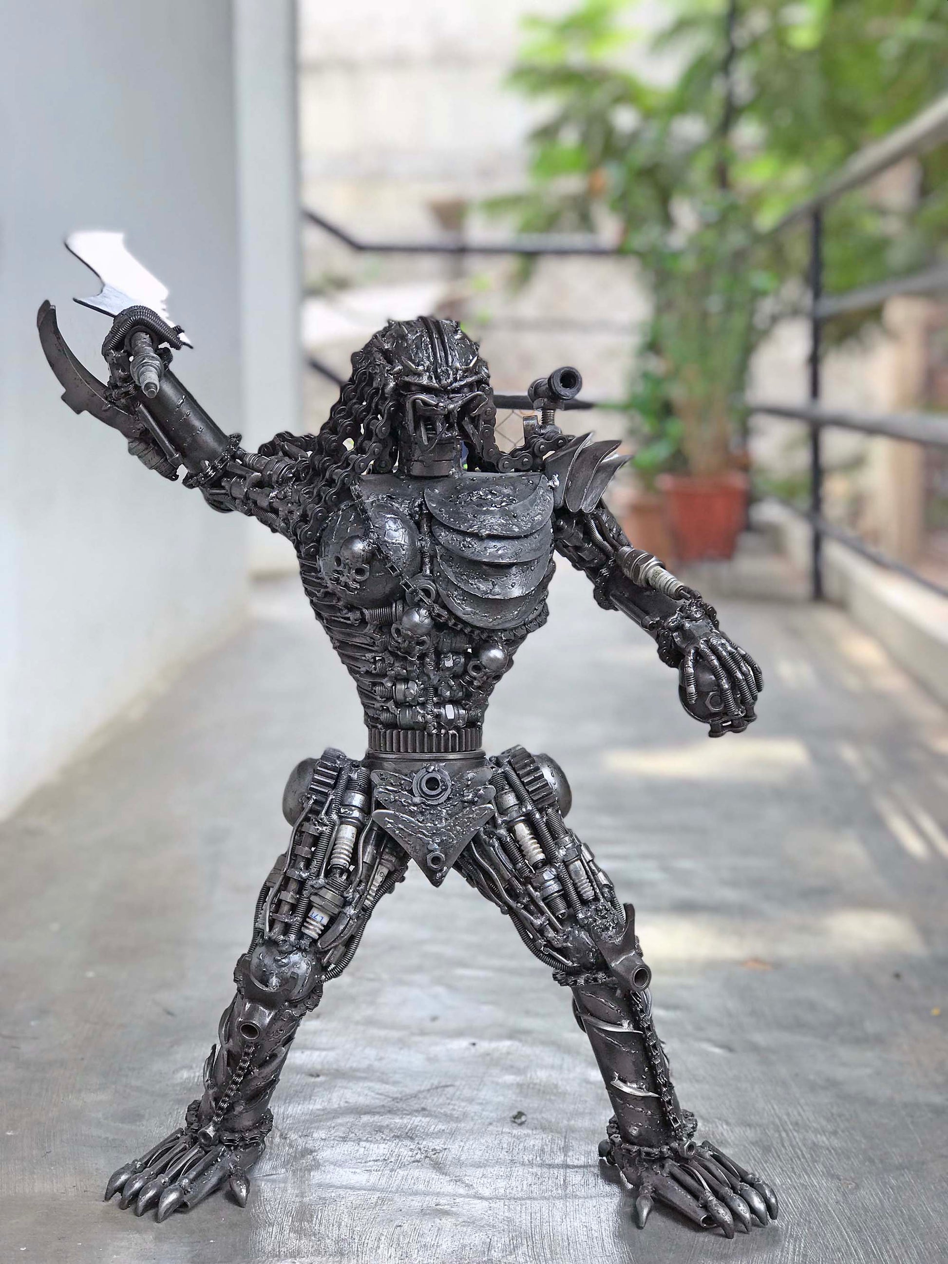 Predator metal action figure hand-crafted from junk auto parts