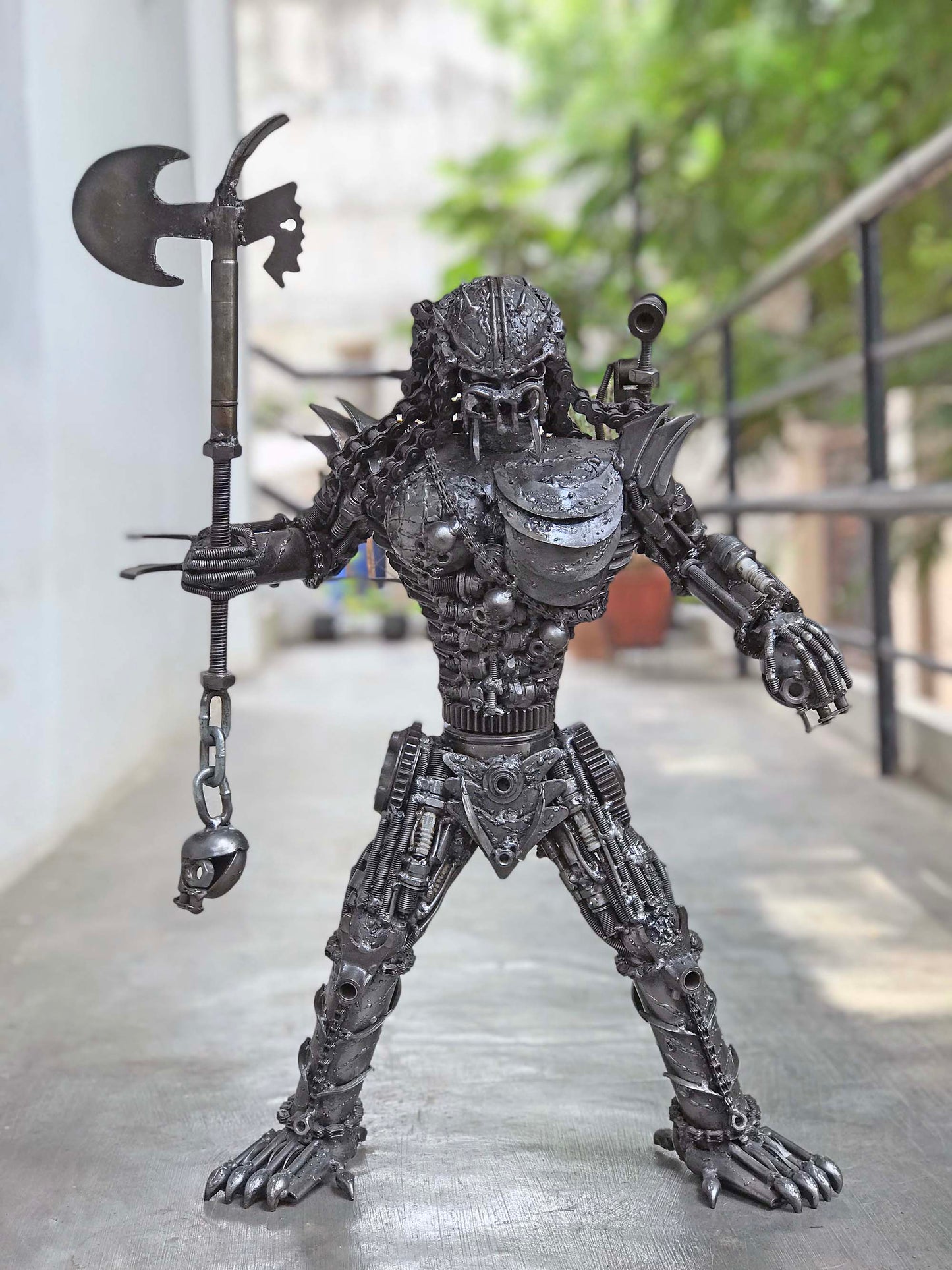 Predator metal action figure hand-crafted from junk auto parts