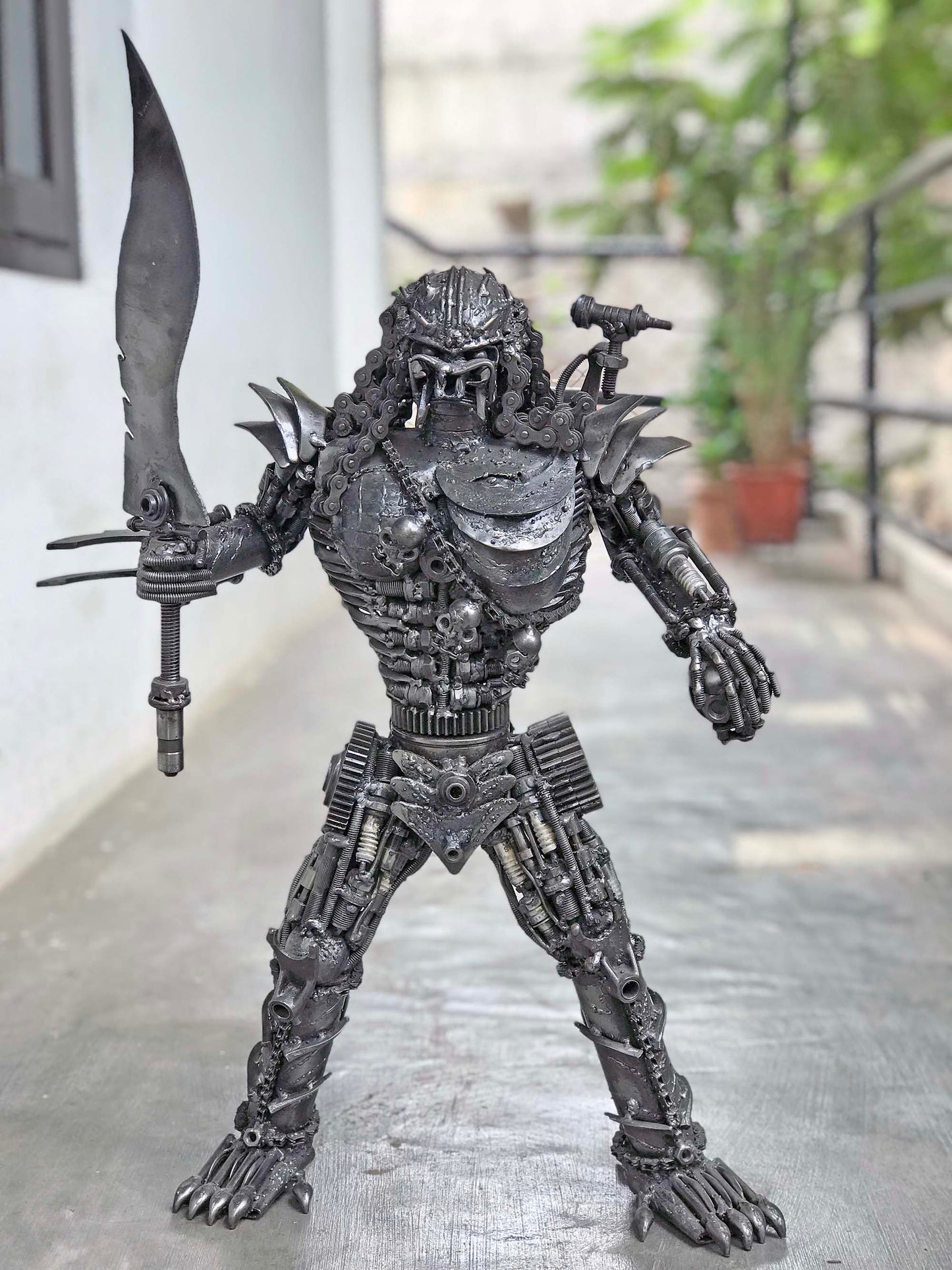Predator metal action figure hand-crafted from junk auto parts