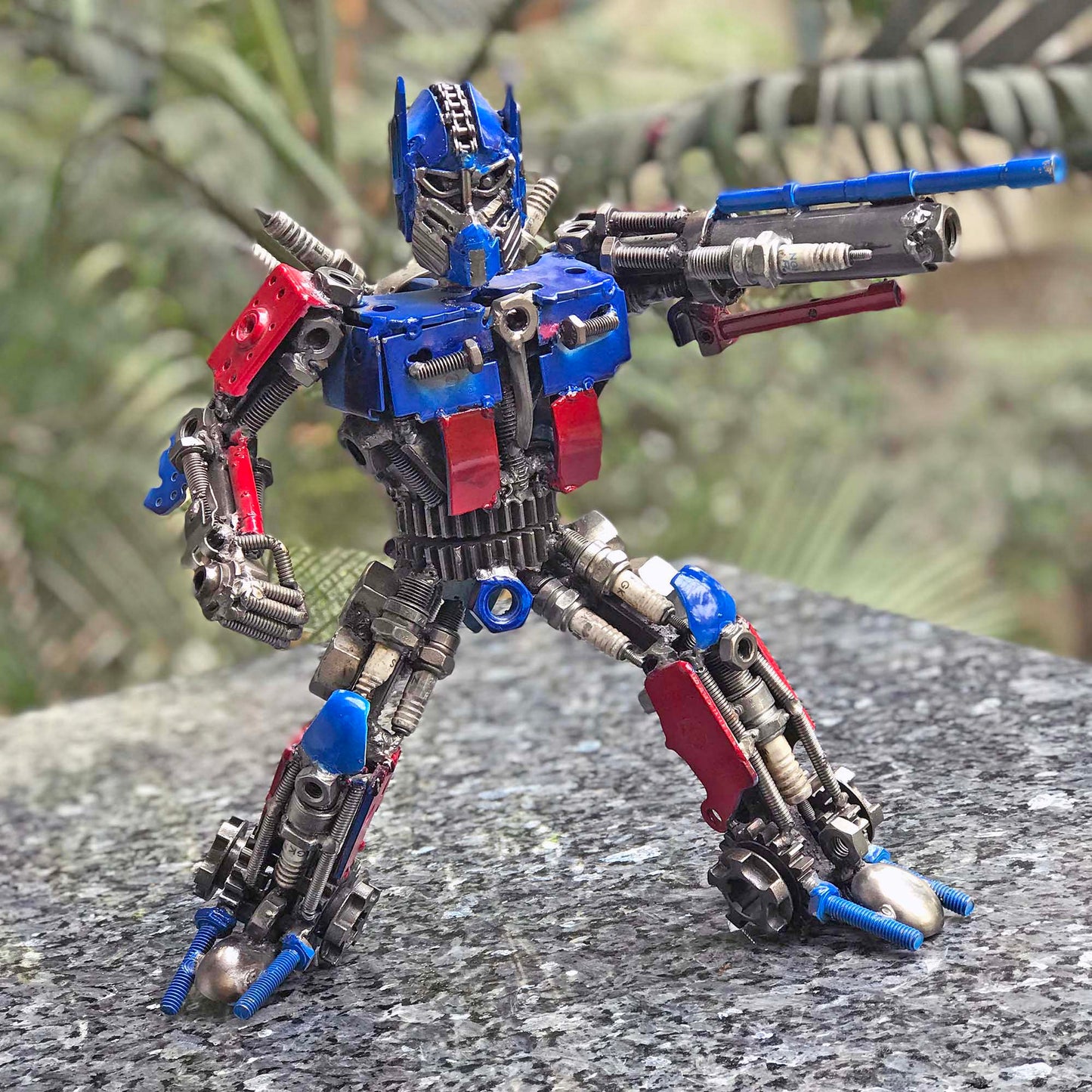 Transformers Optimus Prime metal action figure hand-crafted from junk auto parts with attention to detail