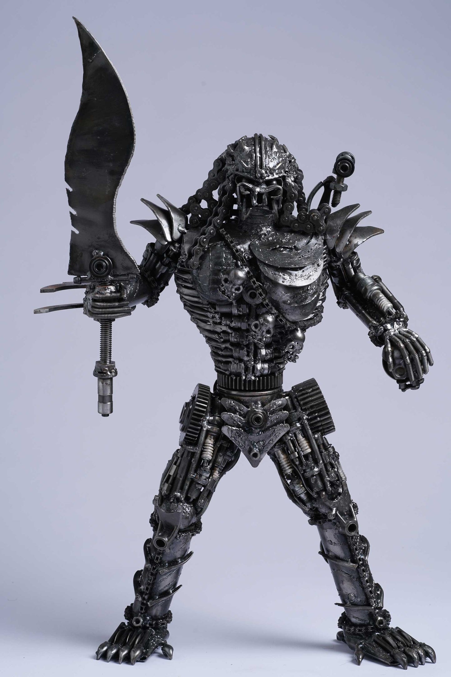 Predator metal action figure hand-crafted from junk auto parts