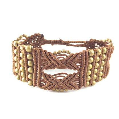 Bracelet handcrafted with Macrame art using highquality strings and brass elements